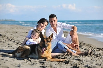 Family on beach with dog SVK