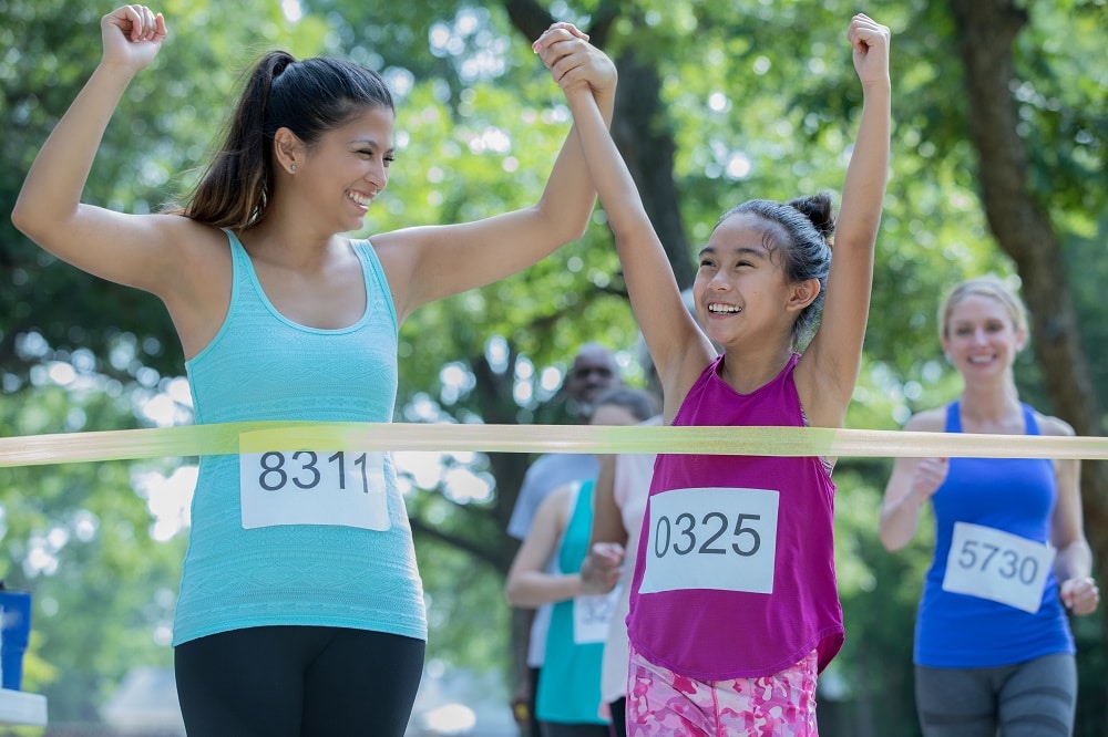 Mother urging child to complete race is an example of the competitiveness of parental peer pressure and c